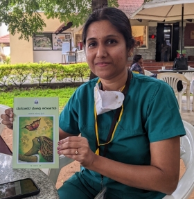Archana Siddaish, MD, holding a book
